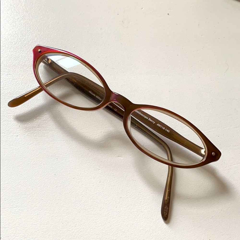 Nicole Miller authentic women’s eyeglasses purple: frame is Dot-com.